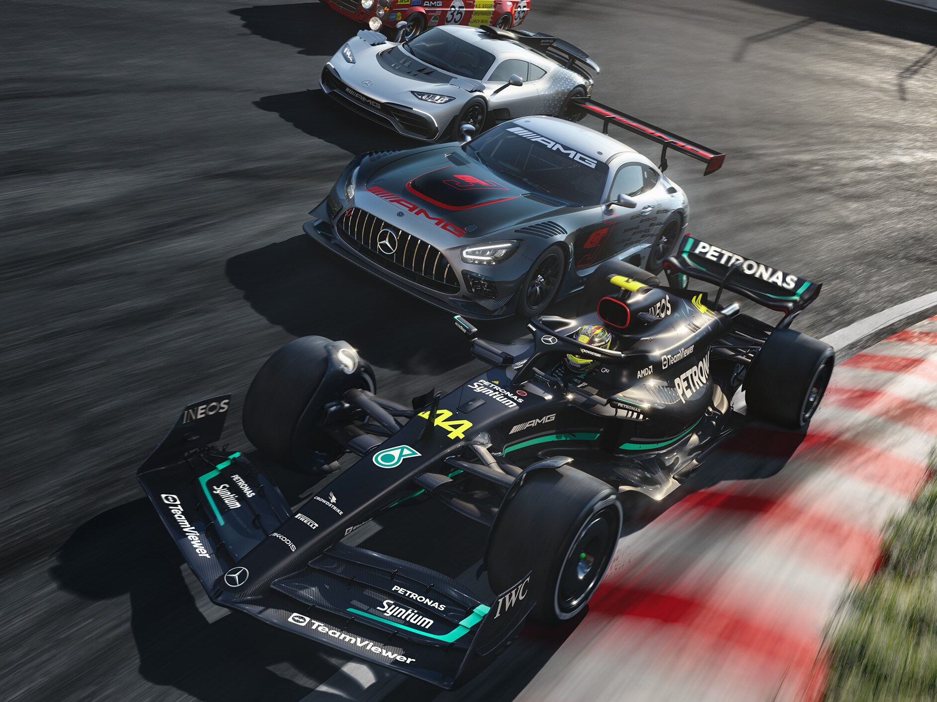 Several Mercedes-AMG sports cars on a race track.